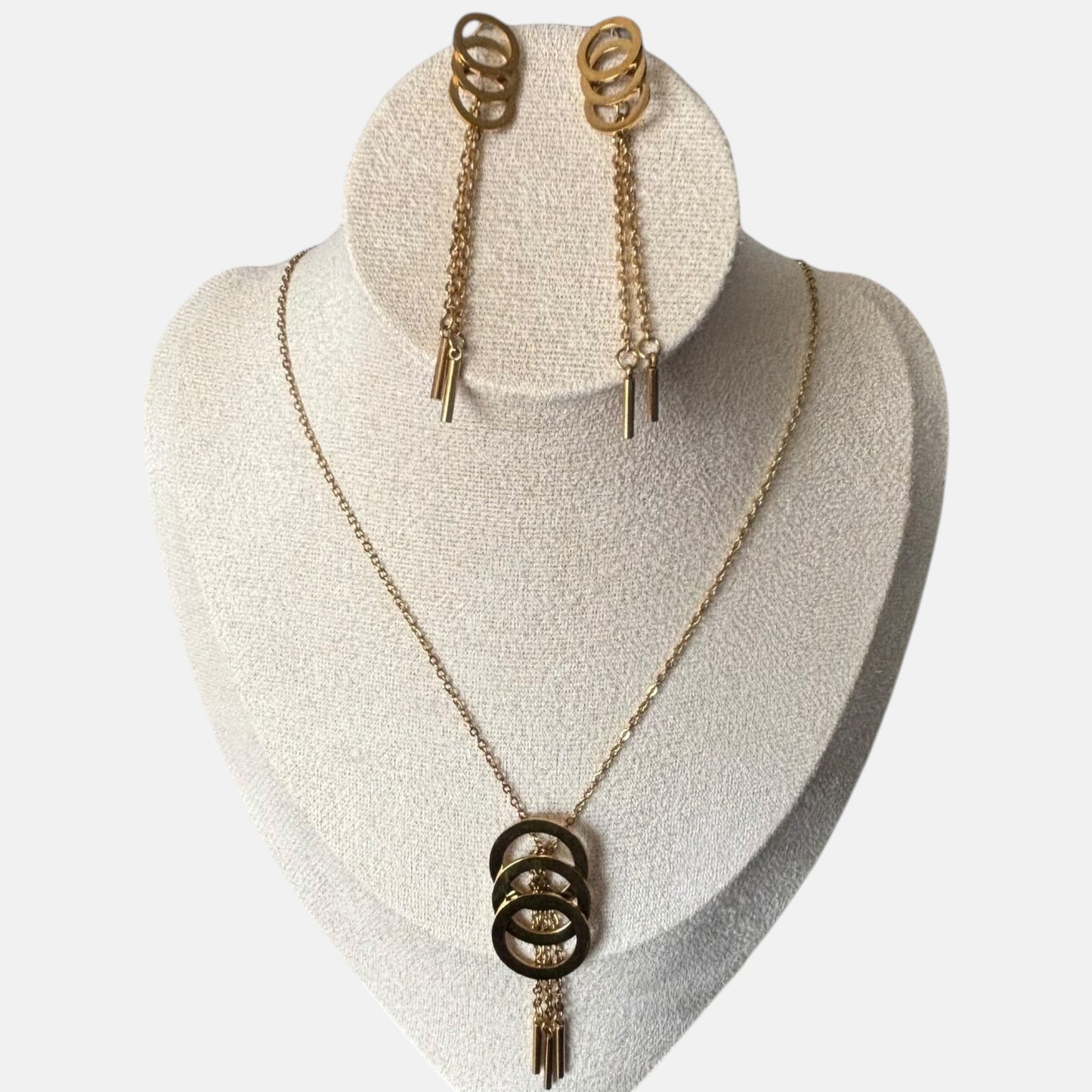Omayra Boutique gold metal-alloy jewelry set with triple circle pendant necklace and matching drop earrings.