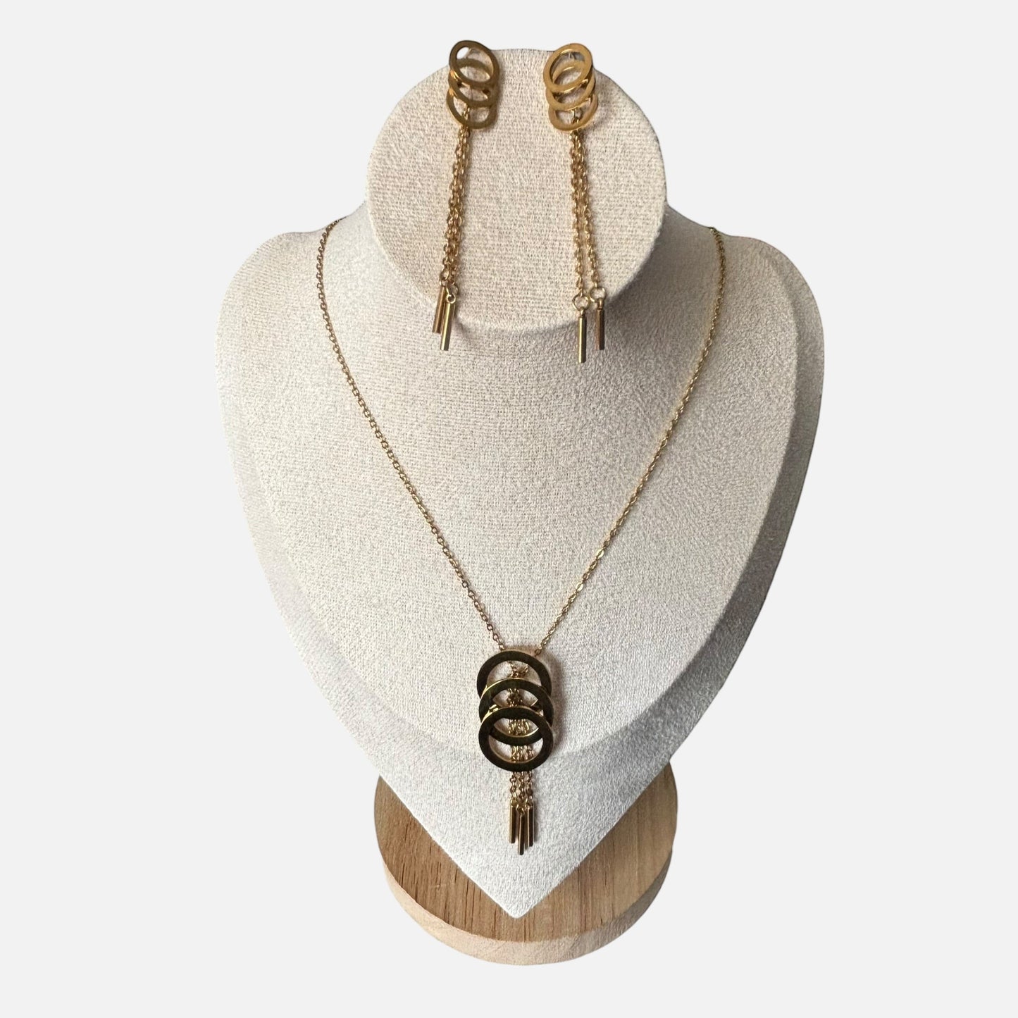 Omayra Boutique gold metal-alloy jewelry set with triple circle pendant necklace and matching drop earrings.