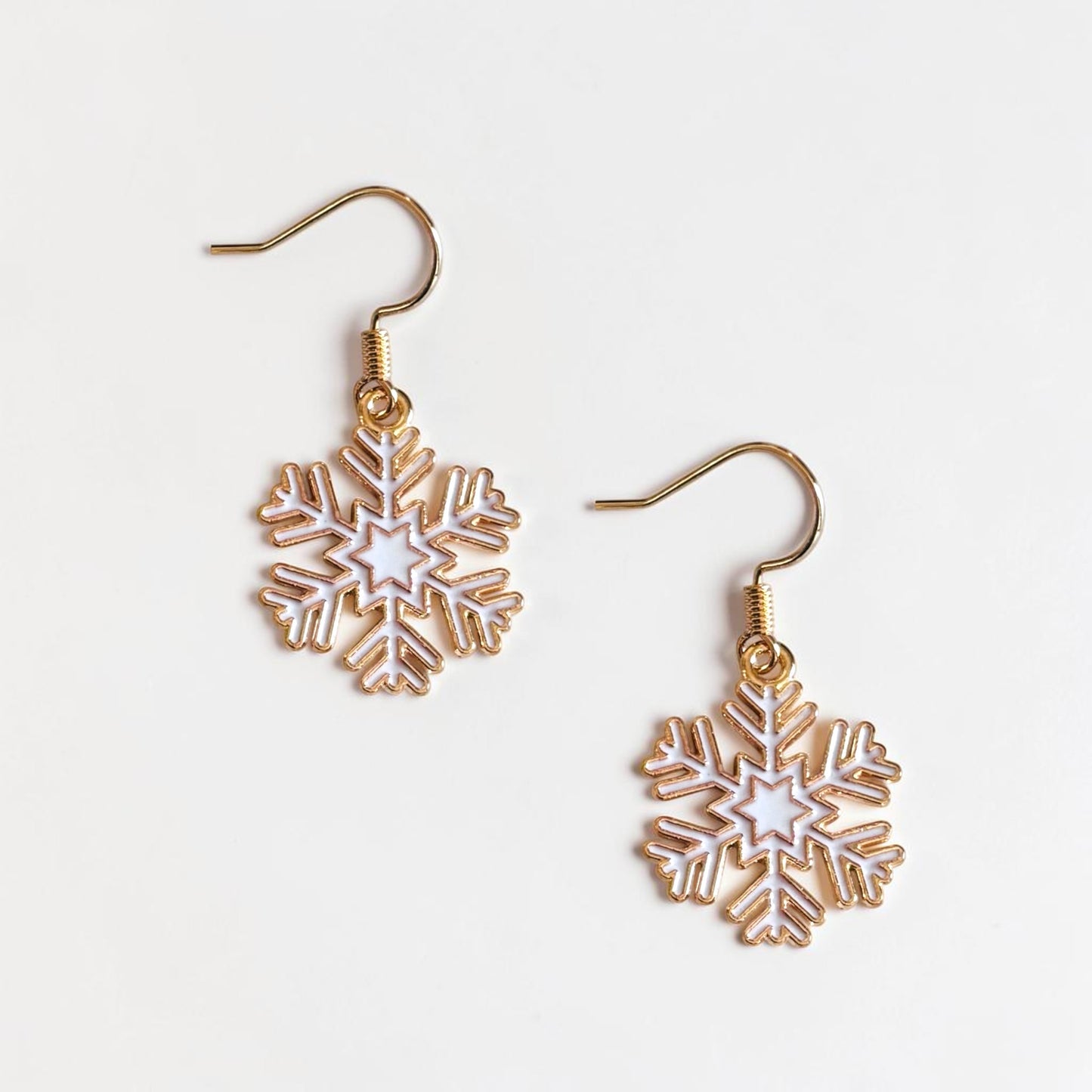 Omayra Boutique small white and gold snowflake dangle earrings, 1.5 inches long, perfect for winter.