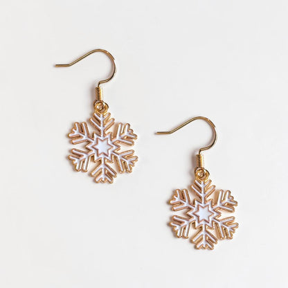 Omayra Boutique small white and gold snowflake dangle earrings, 1.5 inches long, perfect for winter.