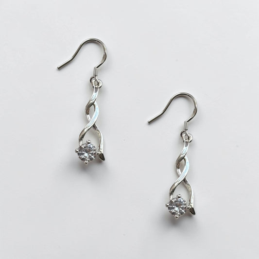 Omayra Boutique Sterling Silver drop earrings with a twisted design and a clear crystal.