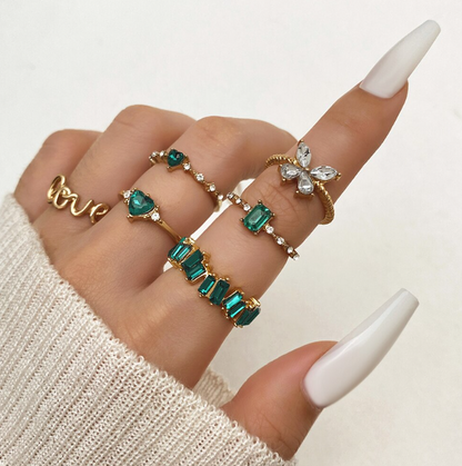 Juego de 6 anillos en oro y verde esmeralda