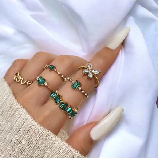 Juego de 6 anillos en oro y verde esmeralda