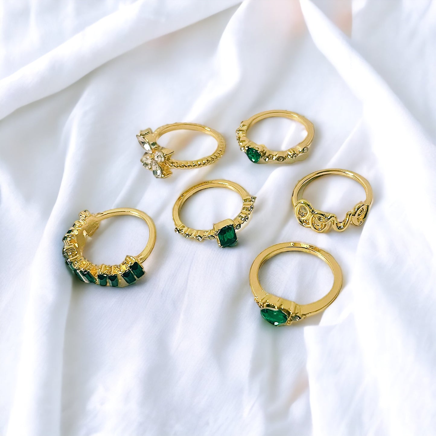 Juego de 6 anillos en oro y verde esmeralda