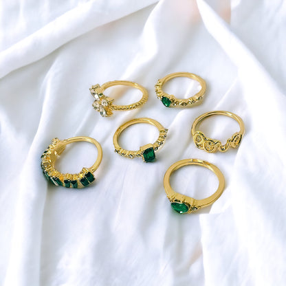 Juego de 6 anillos en oro y verde esmeralda